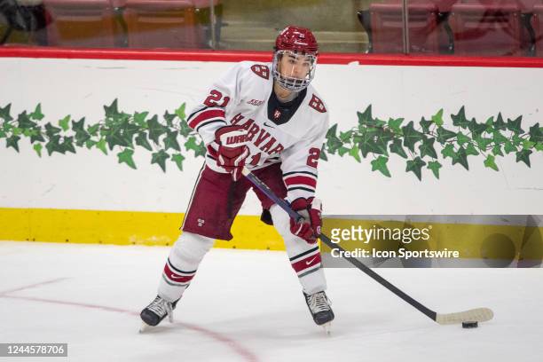 Harvard Crimson forward Sean Farrell passes the puck during a college hockey game between the Brown Bears and the Harvard Crimson on November 4 at...