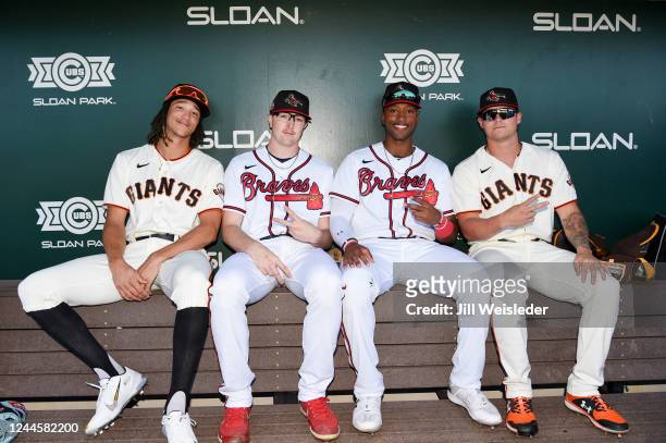 Spencer Bivens, Austin Smith, Justyn-Henry Malloy and Tyler Myrick of the National League Fall Stars pose for a photo in the dugout before the game...