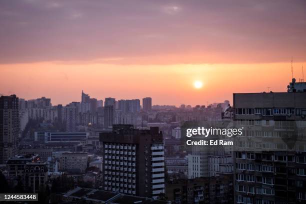 The sun sets over the west of Kyiv on November 07, 2022 in Kyiv, Ukraine. Electricity and heating outages across Ukraine caused by missile and drone...