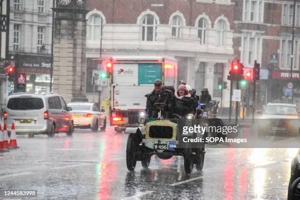 Norfolk Veteran car speeds through the rain at Clapham Common, on the 60 mile run to Brighton. More than 350 veteran cars took part in the annual RM...