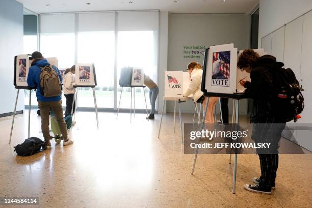 People cast their early ballots for the 2022 general election at the Ann Arbor, Michigan city clerk's satellite office on the campus of the...