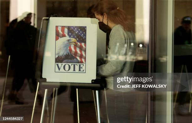 People cast their early ballots for the 2022 general election at the Ann Arbor, Michigan city clerk's satellite office on the campus of the...