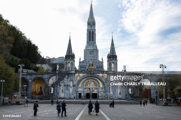 This photograph taken on November 7, 2022 shows the Notre-Dame-du-Rosaire Basilica and the Immaculate Conception Basilica in the Sanctuary of...