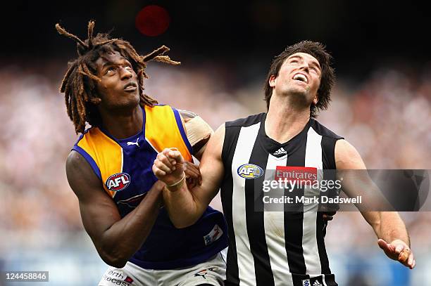 Nick Naitanui of the Eagles contests a boundary throw in with Leigh Brown of the Magpies during the AFL First Qualifying match between the...