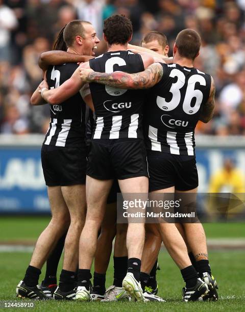 Collingwood players celebrate their win in the AFL First Qualifying match between the Collingwood Magpies and the West Coast Eagles at Melbourne...