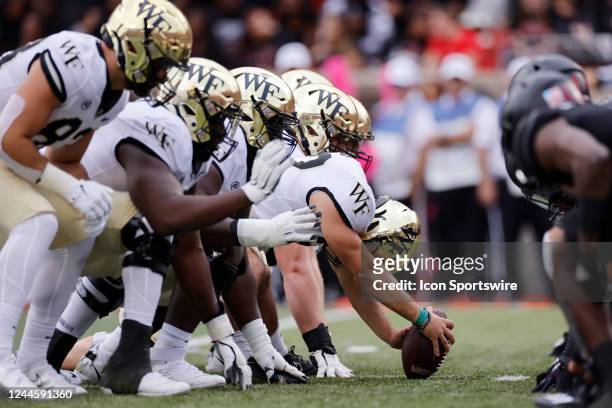 Wake Forest Demon Deacons players line up at the line of scrimmage during a college football game against the Louisville Cardinals on October 29,...