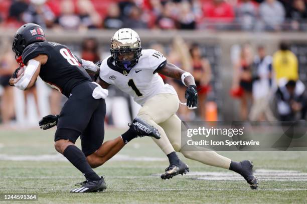 Wake Forest Demon Deacons defensive back Caelen Carson looks to make a tackle on defense during a college football game against the Louisville...