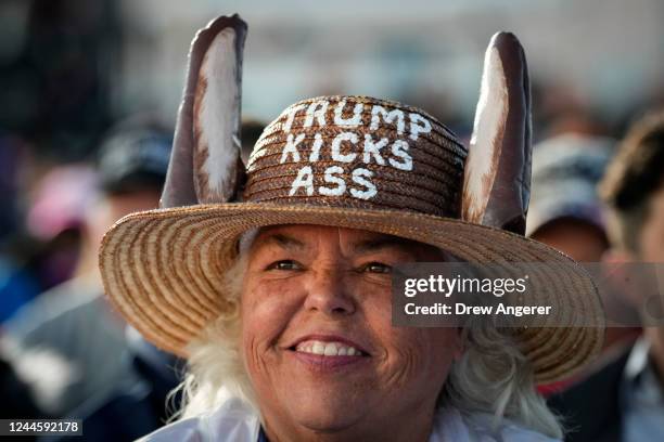 Supporters of former U.S. President Donald Trump await his arrival for a rally at the Dayton International Airport on November 7, 2022 in Vandalia,...