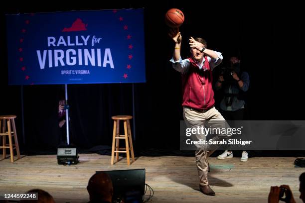 Virginia Governor Glenn Youngkin shoots basketballs at supporters during a rally for Yesli Vega, Republican candidate for northern Virginias 7th...