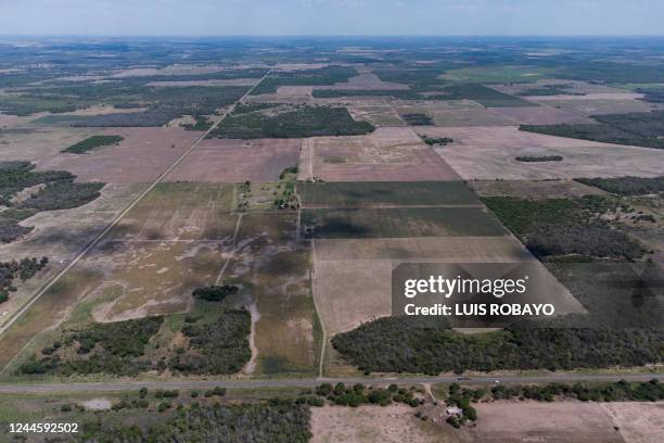 Aerial view of a deforested area on the outskirts of Presidencia Roque Saenz Pena, Chaco province, Argentina, taken on October 25, 2022. - Like huge...