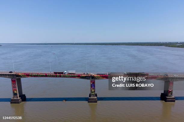 Greenpeace activists protest against the deforestation of the El Chaco forest on the General Manuel Belgrano bridge, which connects the cities of...