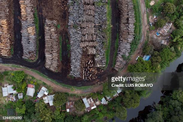 Aerial view of a wood processing factory in Resistencia, Chaco province, Argentina, taken on October 26, 2022. - Like huge scars in the forest of the...