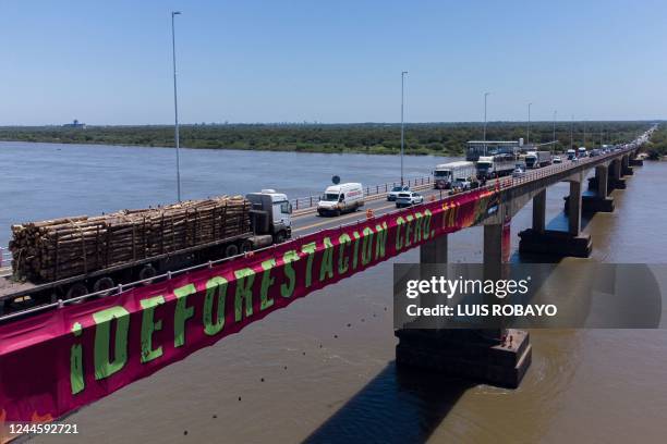 Greenpeace activists protest against the deforestation of the El Chaco forest on the General Manuel Belgrano bridge, which connects the cities of...