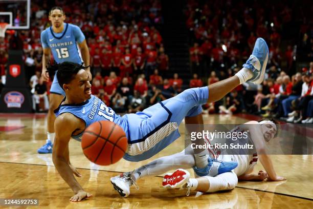 Cameron Shockley-Okeke of the Columbia Lions collides with Paul Mulcahy of the Rutgers Scarlet Knights during the first half of the game at Jersey...