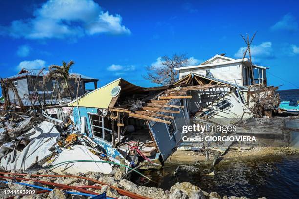 Destroyed homes and debris are seen on Matlacha Island in Lee County, Florida, in the aftermath of Hurricane Ian on November 7 the eve of the midterm...