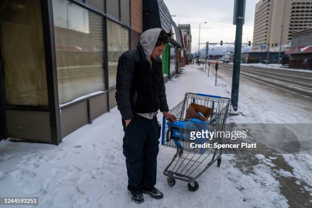 Man pauses on a street downtown where homelessness is a chronic problem, on November 07, 2022 in Anchorage, Alaska. In one of the more closely...