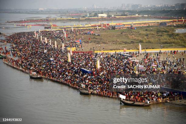 In this photograph taken on October 30 devotees gather to worship the sun during the Hindu festival of Chhath Puja on the banks of river Ganges in...