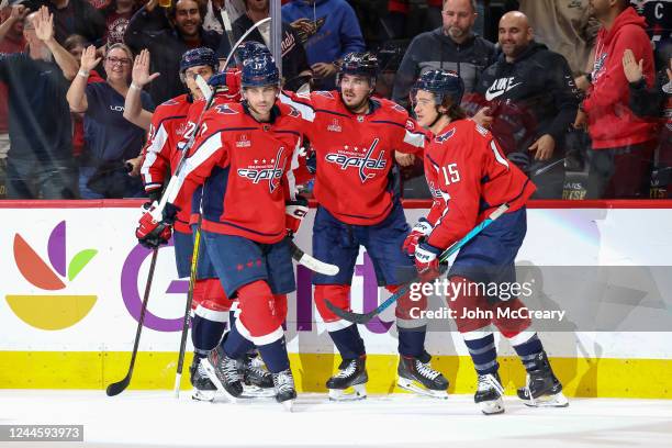 Dylan Strome of the Washington Capitals celebrates a goal with Marcus Johansson, Martin Fehervary and Sonny Milano during a game against the Edmonton...