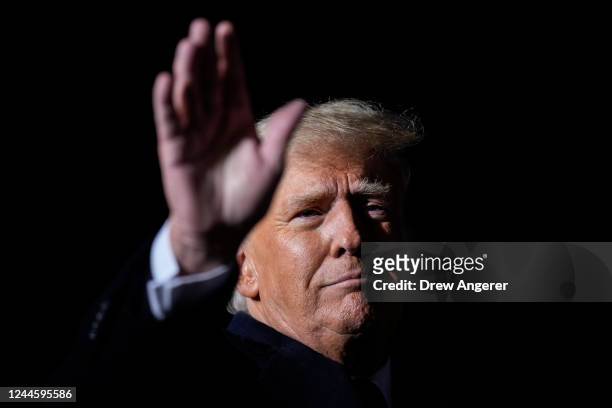 Former U.S. President Donald Trump waves at the end of a rally at the Dayton International Airport on November 7, 2022 in Vandalia, Ohio. Trump is in...