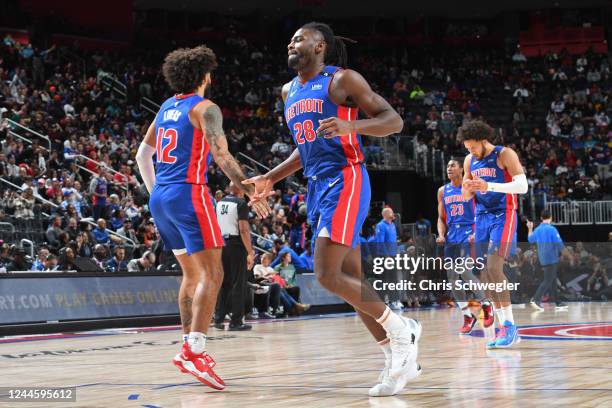 Isaiah Livers and Isaiah Stewart of the Detroit Pistons shake hands against the Oklahoma City Thunder on November 7, 2022 at Little Caesars Arena in...