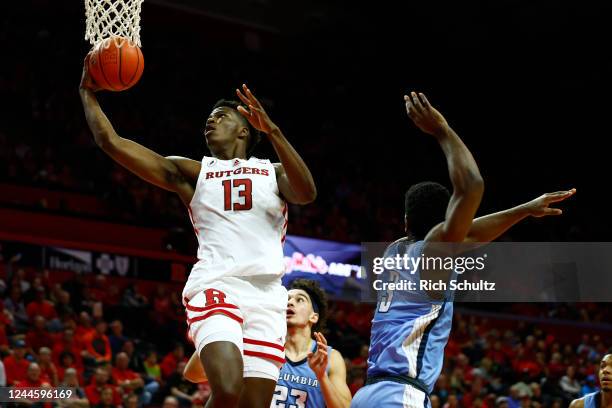 Antwone Woolfolk of the Rutgers Scarlet Knights attempts a shot as Zinou Bedri and Zavian McLean of the Columbia Lions defend during the second half...