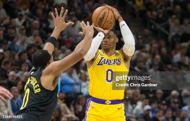 Russell Westbrook of the Los Angeles Lakers shoots over Talen Horton-Tucker of the Utah Jazz during the first half of their game at the Vivint Arena...