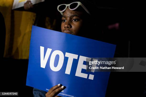 Supporter of Democratic gubernatorial candidate Wes Moore watches the campaign rally at Bowie State University on November 7, 2022 in Bowie,...