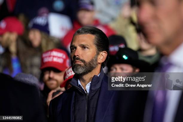Donald Trump Jr. Listens as former President Donald Trump speaks at a rally at the Dayton International Airport on November 7, 2022 in Vandalia,...