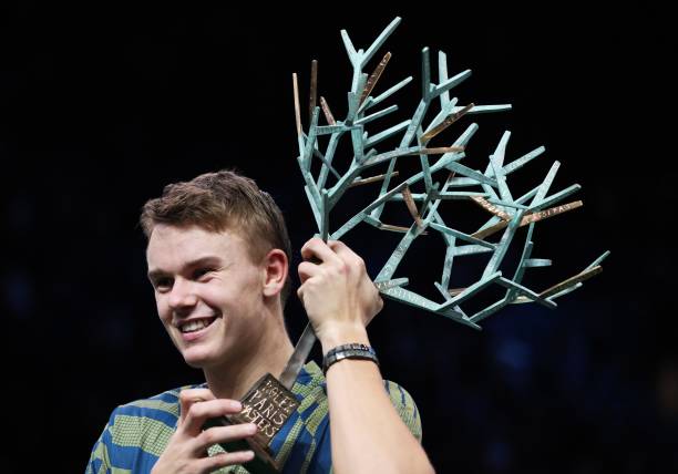 Holger Rune of Denmark displays his trophy during the awarding ceremony after the men's singles final match between Holger Rune of Denmark and Novak...