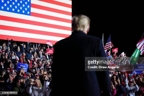 Former U.S. President Donald Trump arrives onstage to cheering supporters at a rally for Ohio Republicans at the Dayton International Airport on...