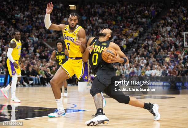 Talon Horton-Tucker of the Utah Jazz is fouled by Troy Brown Jr., #7 of the Los Angeles Lakers during the second half of their game at the Vivint...