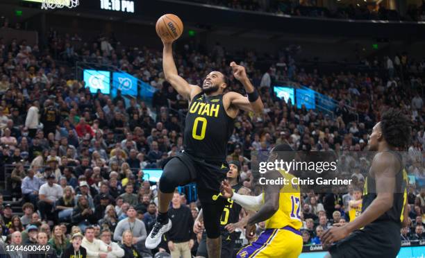 Talon Horton-Tucker of the Utah Jazz flies to the basket over Kendrick Nunn of the Los Angeles Lakers during the second half of their game at the...