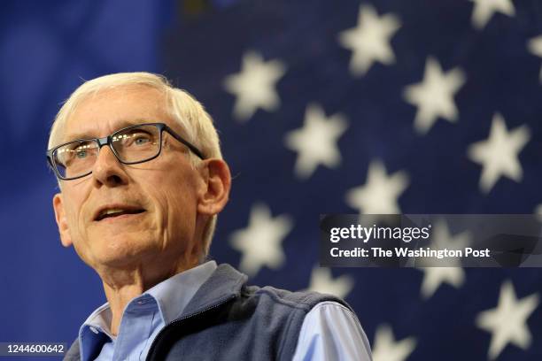 Milwaukee, WI Wisconsin Governor Tony Evers pauses while speaking before welcoming former President Barack Obama at rally at North Division High...