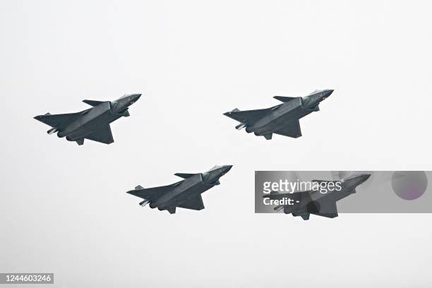 Chinese J-20 stealth fighters of the People's Liberation Army perform at the Airshow China 2022 in Zhuhai in southern China's Guangdong province on...