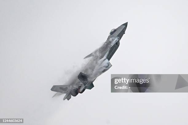 Chinese J-20 stealth fighter of the People's Liberation Army performs at the Airshow China 2022 in Zhuhai in southern China's Guangdong province on...