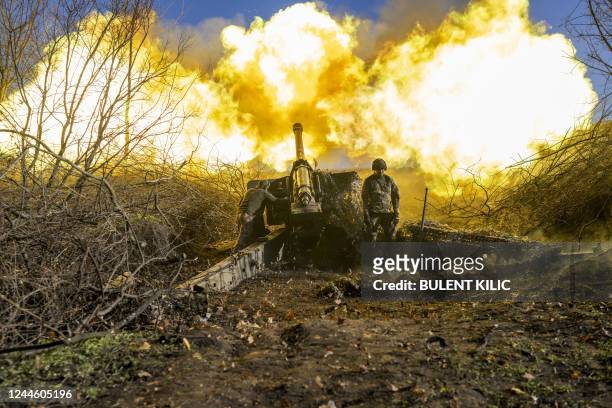 Ukrainian soldier of an artillery unit fires towards Russian positions outside Bakhmut on November 8 amid the Russian invasion of Ukraine.