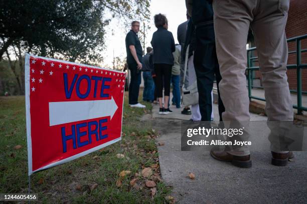 People wait in line to vote at a polling place on November 8, 2022 in Fuquay Varina, North Carolina, United States. After months of candidates...