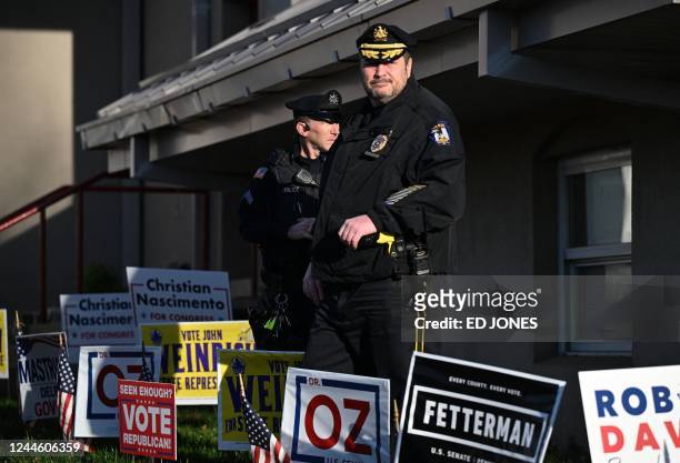 Police provide security during the US midterm election at a polling station in Bryn Athyn, Pennsylvania, on November 8, 2022.