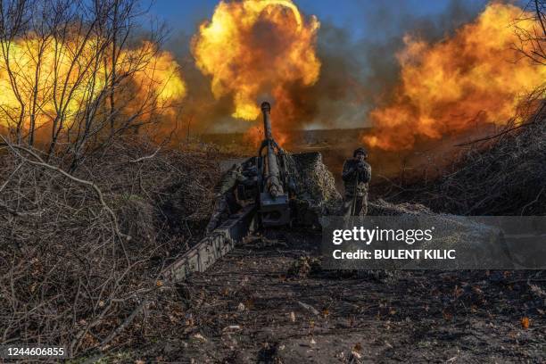 Ukrainian soldier of an artillery unit fires towards Russian positions outside Bakhmut on November 8 amid the Russian invasion of Ukraine.