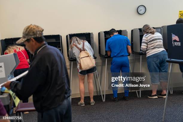 People vote at a polling place on November 8, 2022 in Fuquay Varina, North Carolina. After months of candidates campaigning, Americans are voting in...