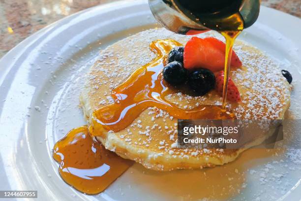 Traditional American pancakes with maple syrup are served in a restaurant in Washington, D.C., United States on October 21, 2022.