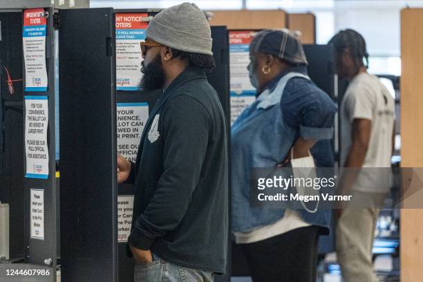 Community members arrive to their local polling location to vote on November 8, 2022 in Atlanta, Georgia. After months of candidates campaigning,...