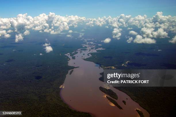 Aerial view showing the Essequibo River running in a section of the Amazon rainforest in the Potaro-Siparuni region of Guyana, taken on September 24,...