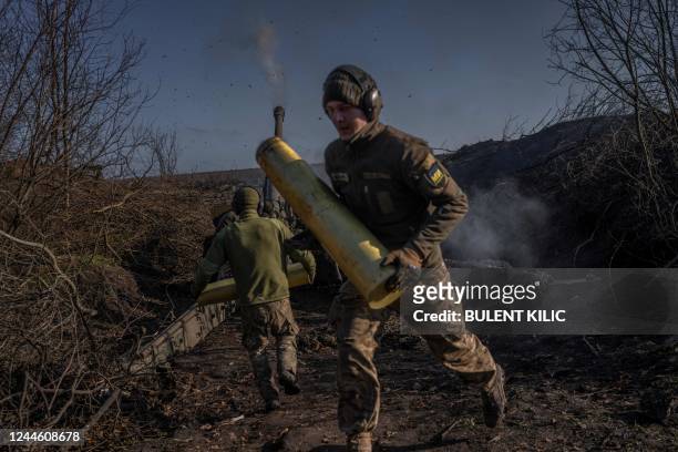 Ukrainian soldiers of an artillery unit fire towards Russian positions outside Bakhmut on November 8 amid the Russian invasion of Ukraine.
