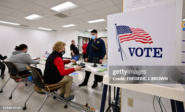 People check in before voting for the 2022 Midterm Elections at the Los Angeles County Registrar in Norwalk, California on November 8, 2022.