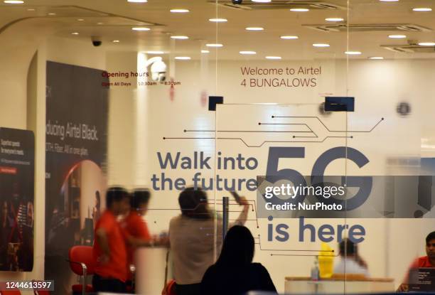 Girl takes a selfie picture inside an Airtel store where 5G logo is written on a door of Airtel Store in Mumbai, India, 08 November, 2022. Within a...