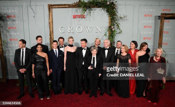 Australian actor Elizabeth Debicki and English actor Dominic West pose with cast members and Netflix management, on the red carpet upon arrival to...