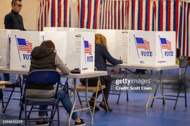 People fill out their ballots at Bedford High School on November 08, 2022 in Bedford, New Hampshire. After months of candidates campaigning,...