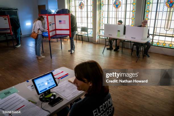 Voters cast their ballots at a polling location inside the Museum of Contemporary Art on November 8, 2022 in Arlington,Virginia. After months of...