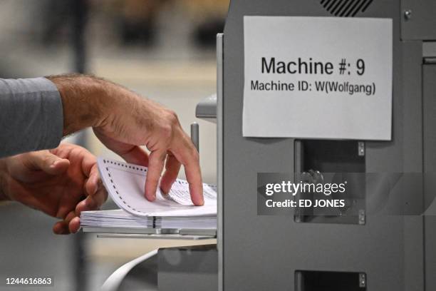 Workers process ballots at an elections counting warehouse outside Philadelphia, Pennsylvania on November 8, 2022.